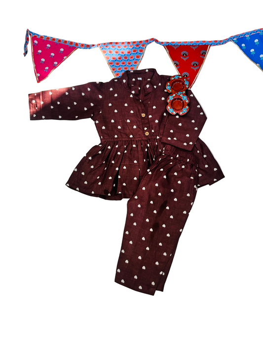 Gathered polka dot printed top with front button opening