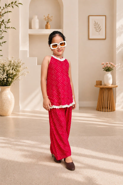 Rani Pink Coloured Bandhej halter neck kurti with Farshi salwar.