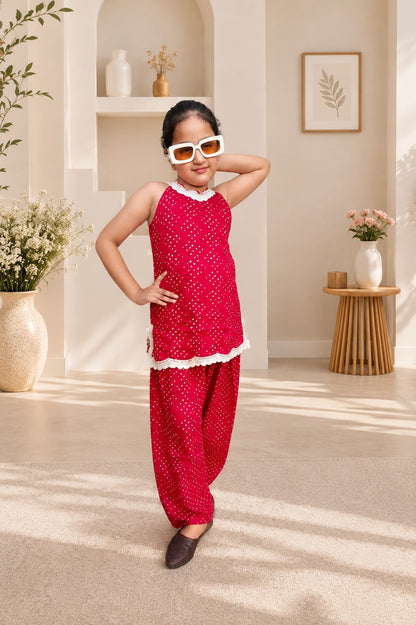 Rani Pink Coloured Bandhej halter neck kurti with Farshi salwar.
