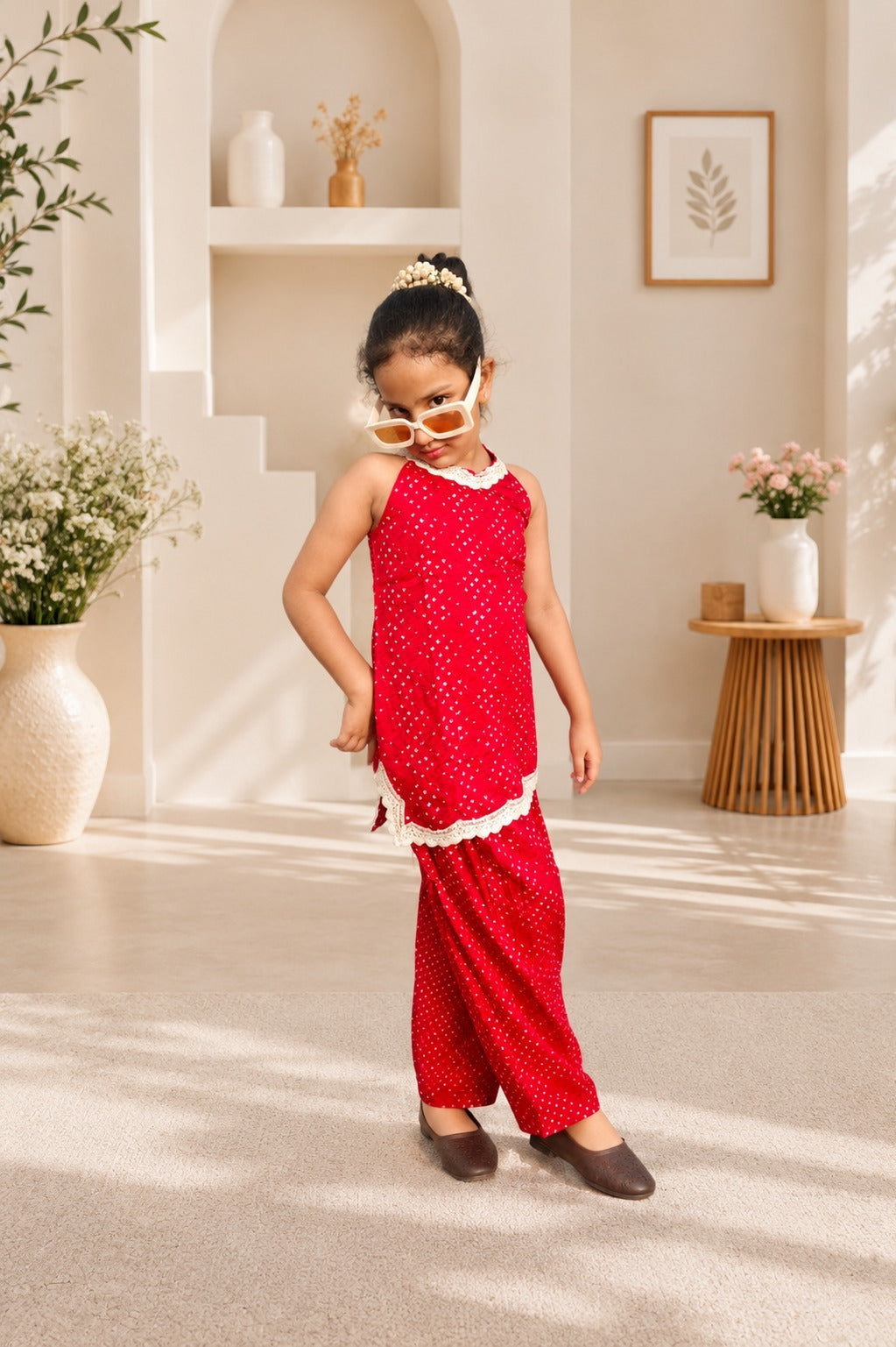 Rani Pink Coloured Bandhej halter neck kurti with Farshi salwar.
