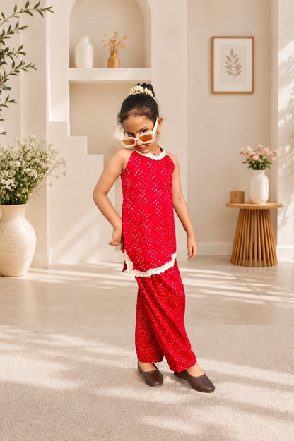 Rani Pink Coloured Bandhej halter neck kurti with Farshi salwar.