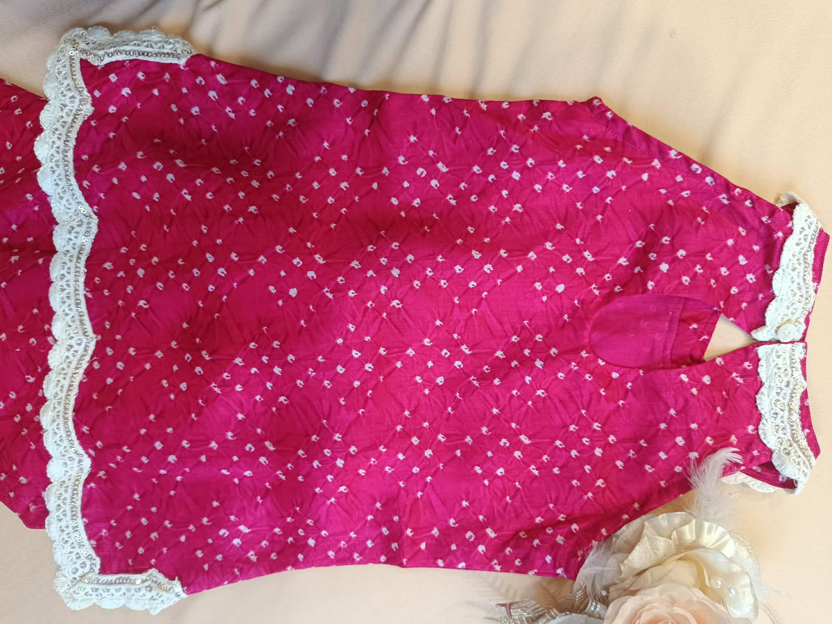 Rani Pink Coloured Bandhej halter neck kurti with Farshi salwar.