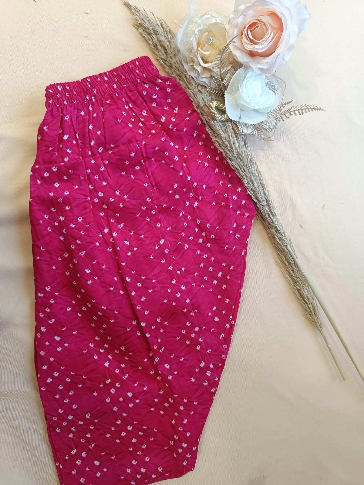 Rani Pink Coloured Bandhej halter neck kurti with Farshi salwar.