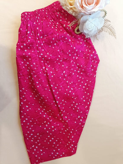 Rani Pink Coloured Bandhej halter neck kurti with Farshi salwar.