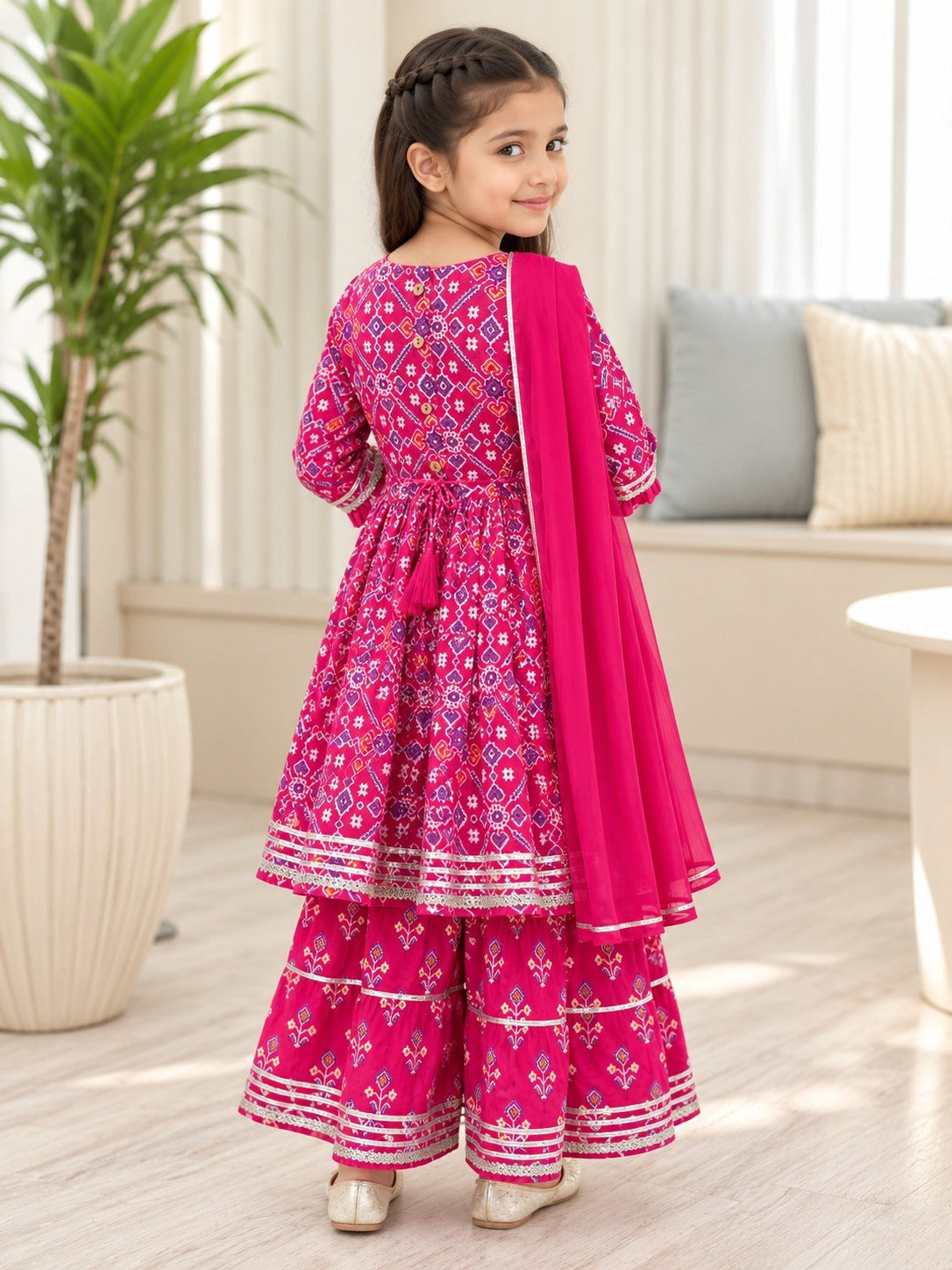 Patola printed, Pink colored flared kurti with sharara and dupatta