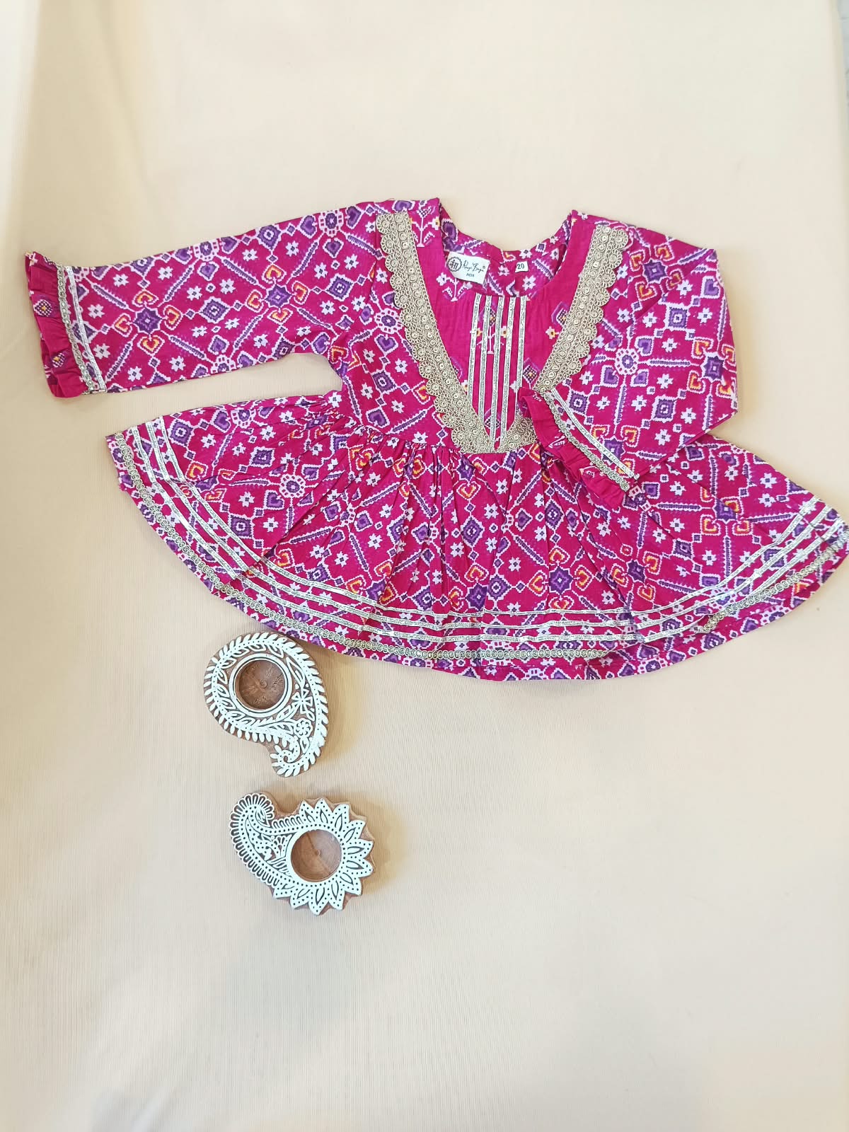 Patola printed, Pink colored flared kurti with sharara and dupatta