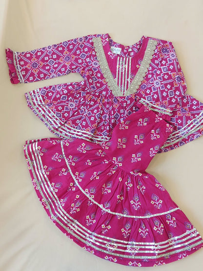 Patola printed, Pink colored flared kurti with sharara and dupatta